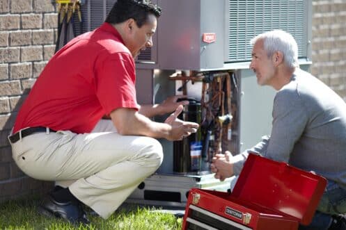 HVAC Technician Explaining AC Repair to Customer in Phoenix, AZ