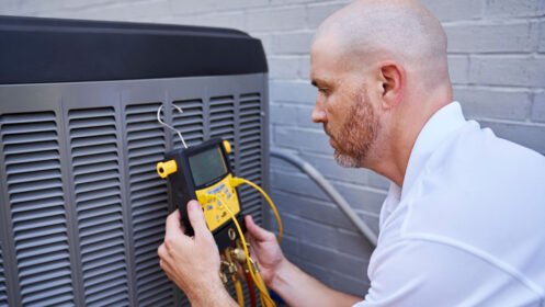 HVAC Technician Performing AC Maintenance in Glendale, AZ