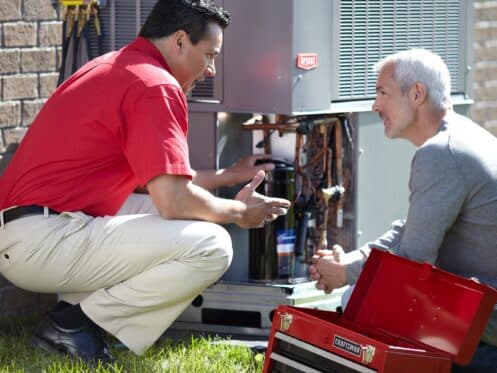 HVAC Technician Explaining AC Repair to Customer in Phoenix, AZ